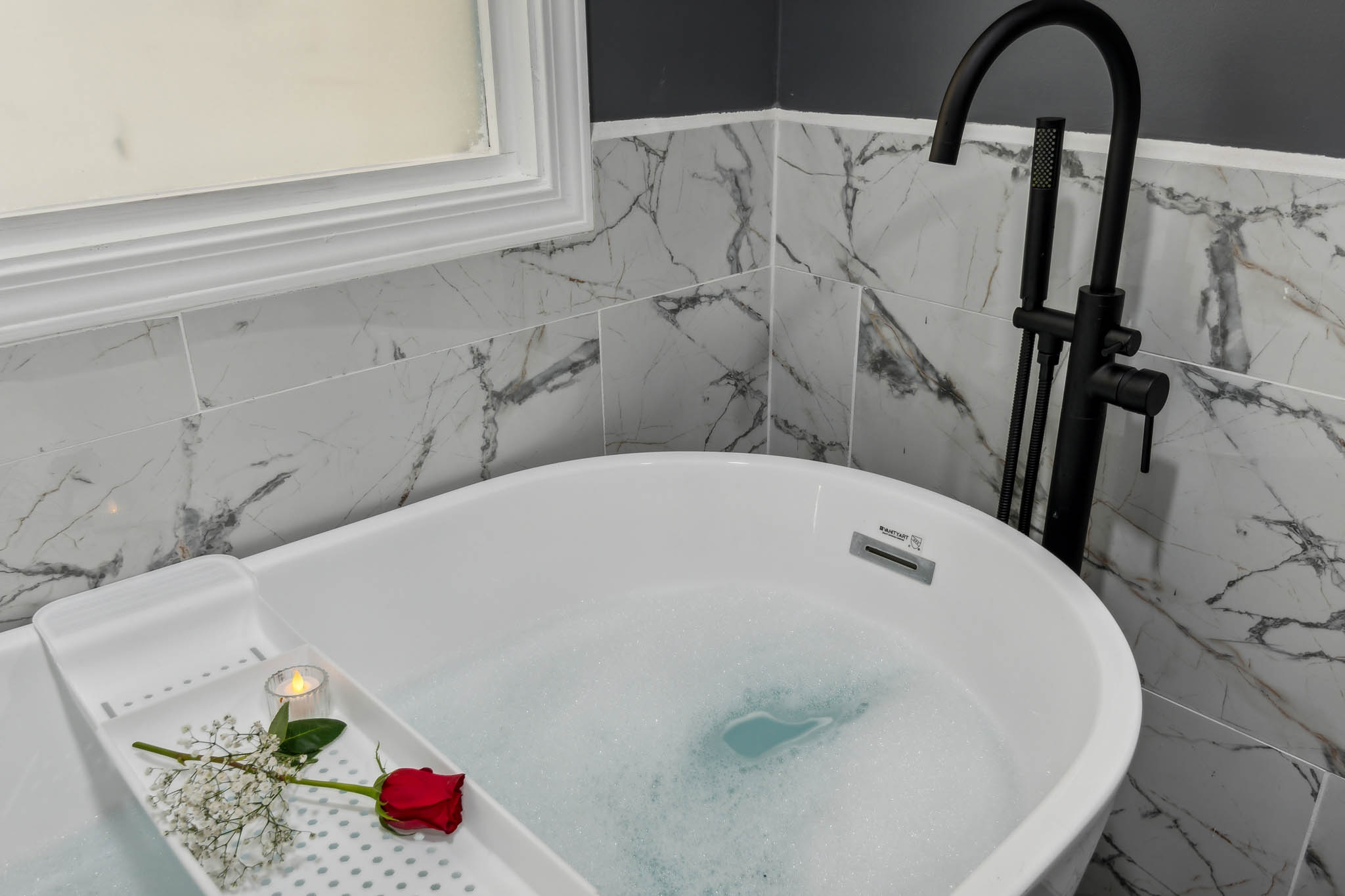 Bath tray with candle and floral decor, The Retreat at Douglasville