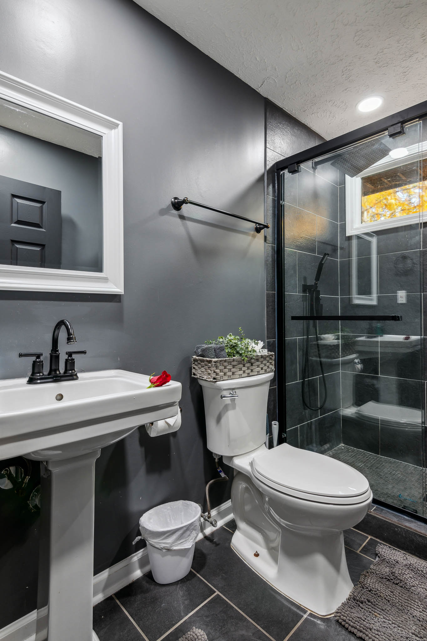 Shower shelf with flowers and bath products, The Retreat at Douglasville