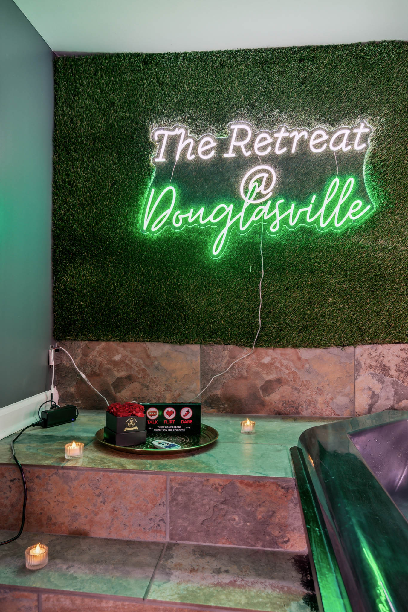 Spa seating with towels and lantern accent, The Retreat at Douglasville